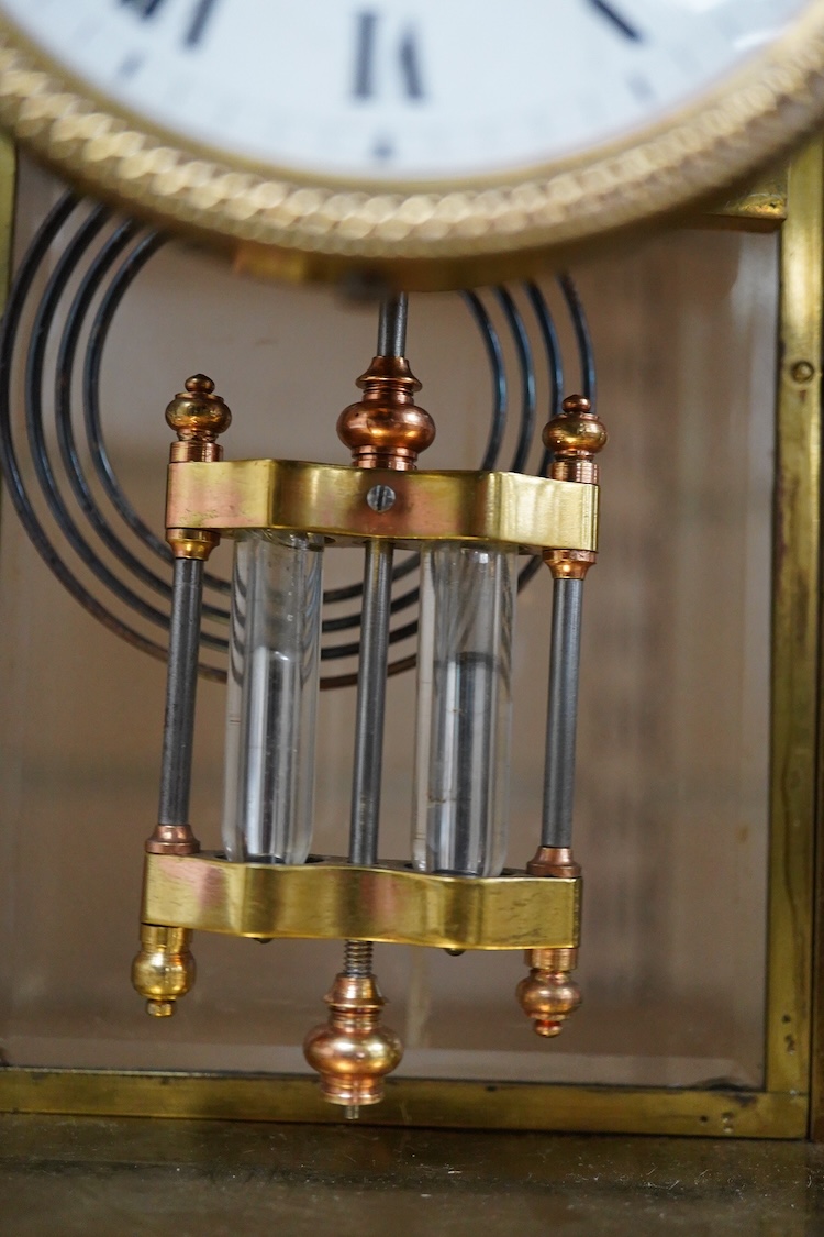 A late 19th century French brass four glass mantel clock, 25.5cm high